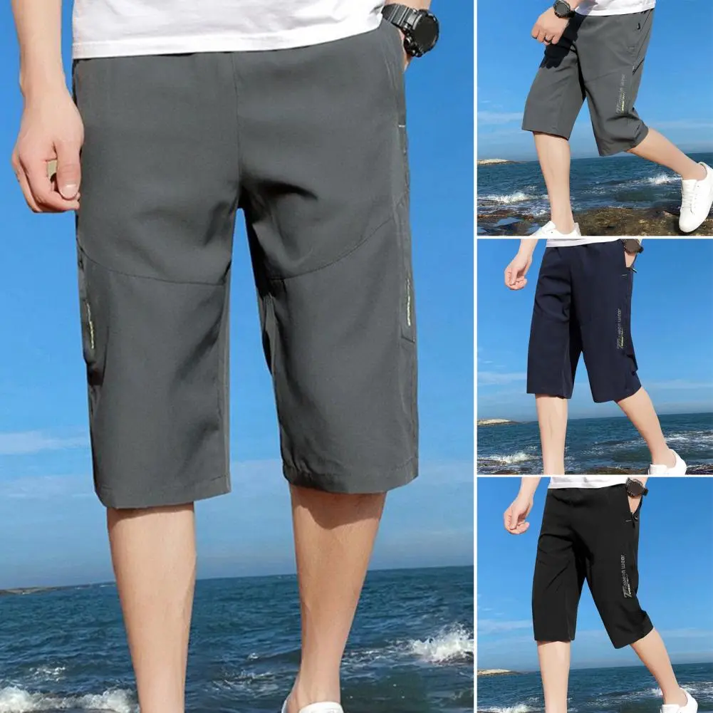 Men Cropped Pants Elastic Waist Loose Ice Silk Casual Pants Zipper Pockets Solid Color Mid Waist Men Mid-calf Length Trousers