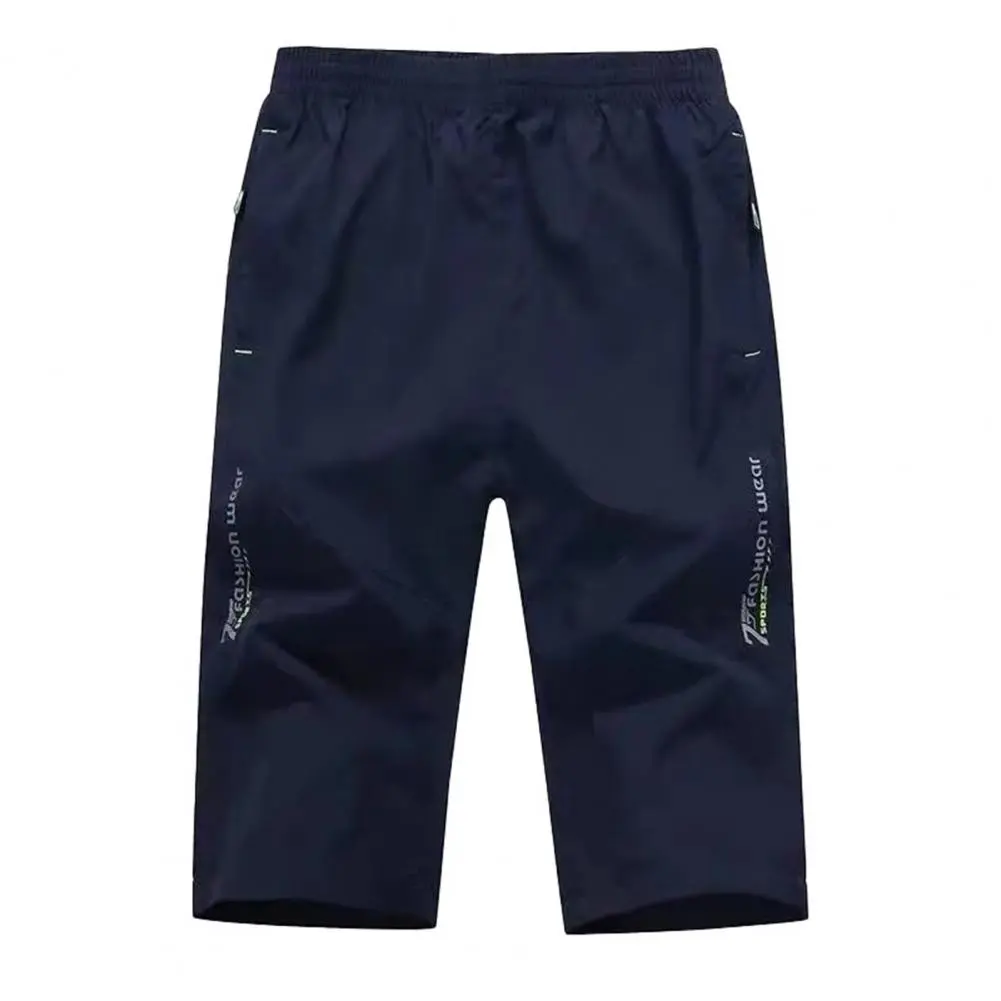 Men Cropped Pants Elastic Waist Loose Ice Silk Casual Pants Zipper Pockets Solid Color Mid Waist Men Mid-calf Length Trousers