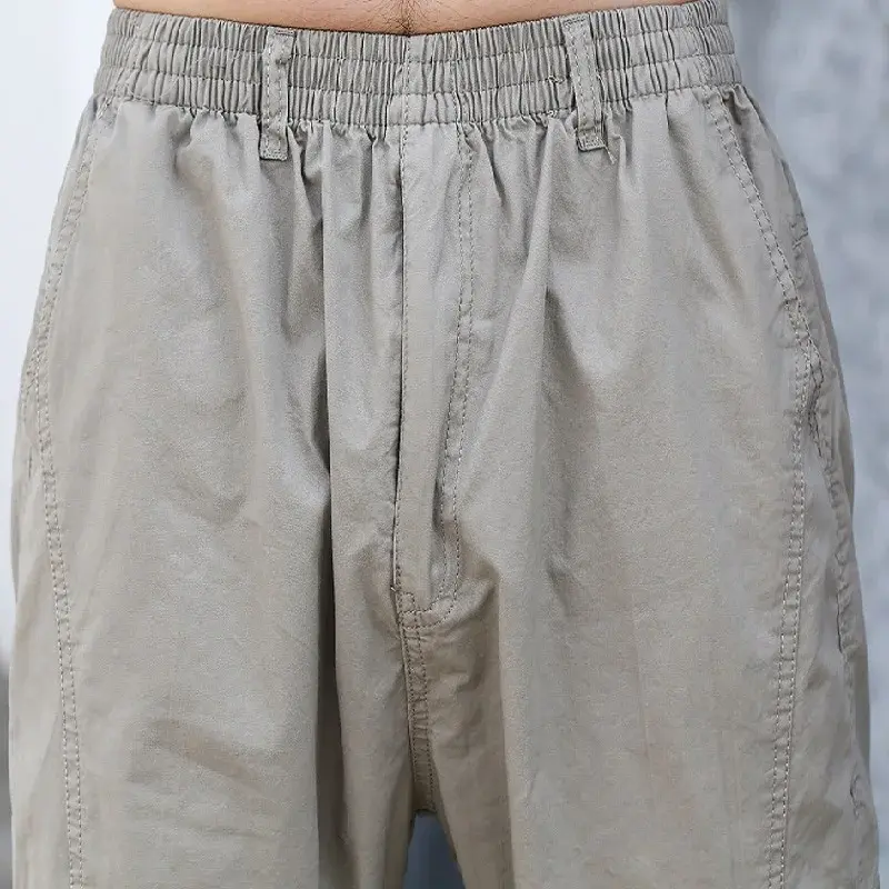 Quality Men Cotton Multiple Pockets Cargo Pants Loose Straight Casual Trousers Spring Male Solid Elastic Waist Tooling Pants 6XL