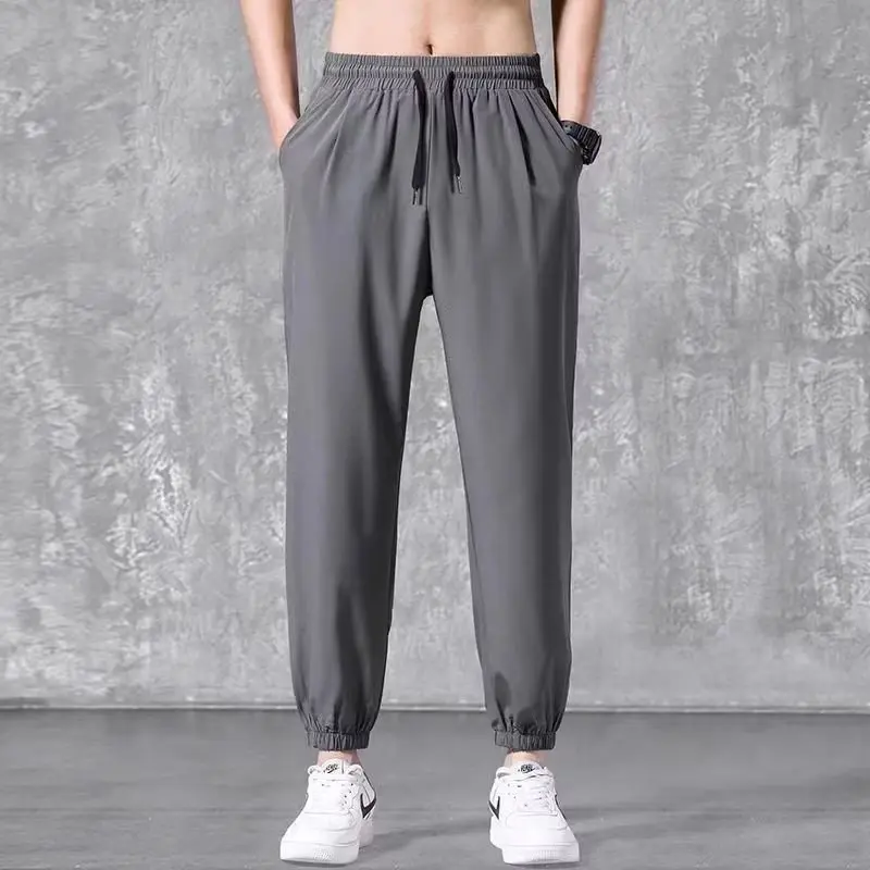 Men's Summer Thin Ice Silk Student Solid Color Straight Tube Loose Wide Leg Bundle Foot Casual Nine Point Pants Sports Men's Pan