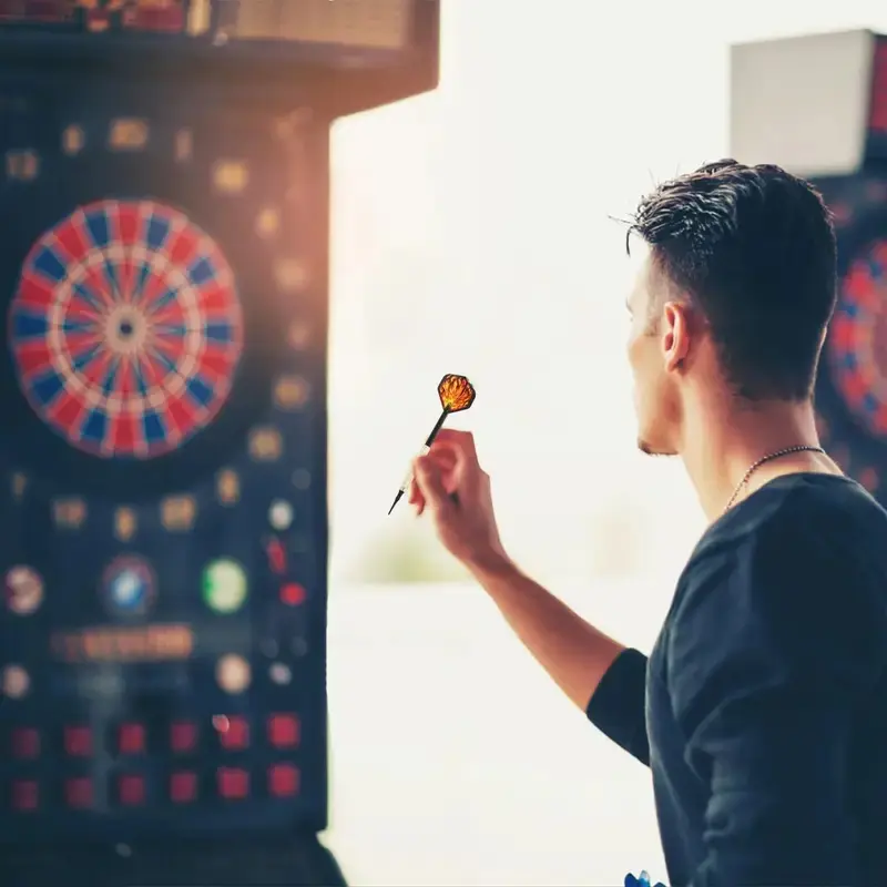 1 set of 12 soft-pointed darts, including 24 replaceable flame dart wings and 100 additional pointed iron and copper darts