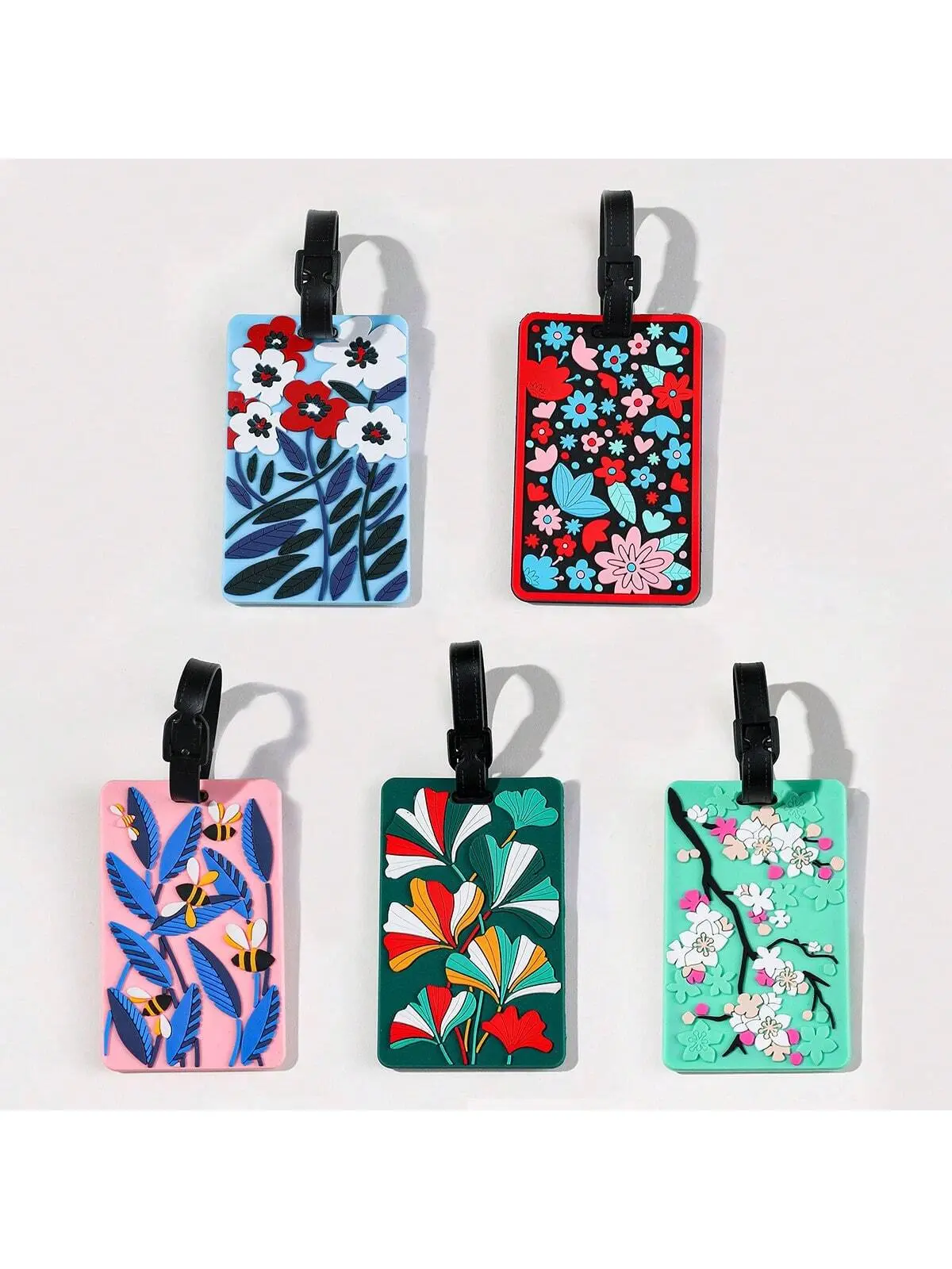 Luggage tags with floral patterns, aircraft boarding passes with colored luggage identifiers, and travel identification tagsA-DH