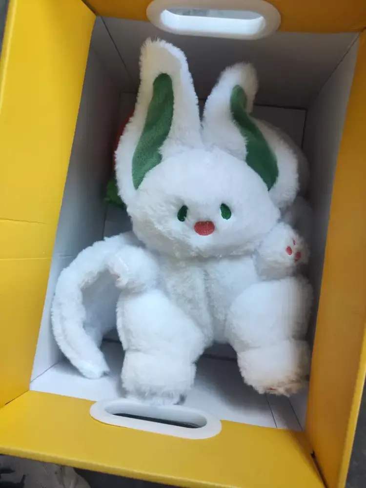 Cotton doll, smiling bat, big white rabbit plush toy, giving a birthday gift to a friend