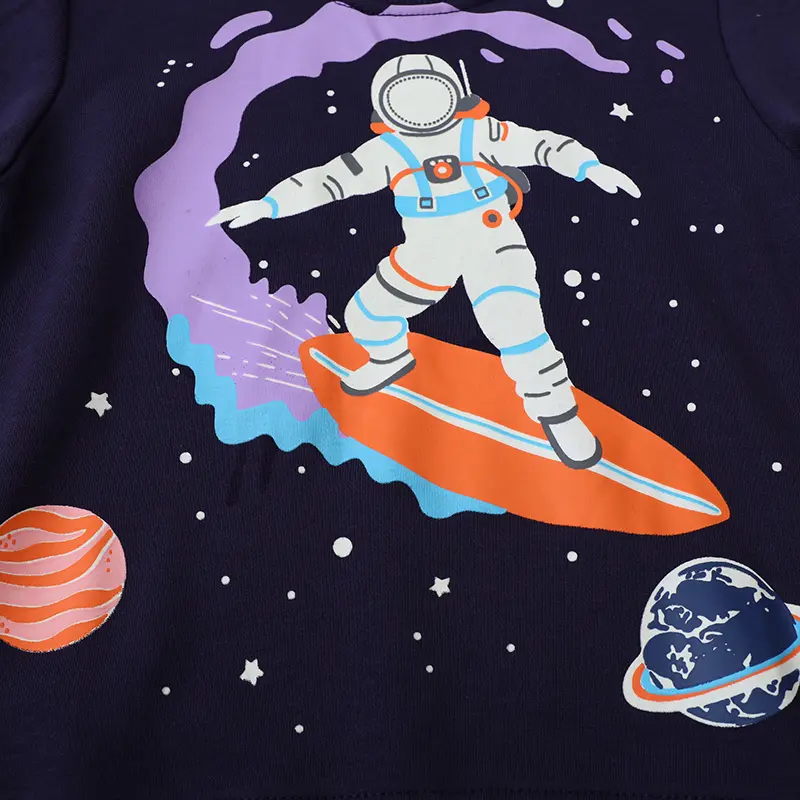 Eye Catching Navy Blue Long Sleeve Sweatshirt with Glow in the Dark Feature Unique Astronaut Surfing in Space Design
