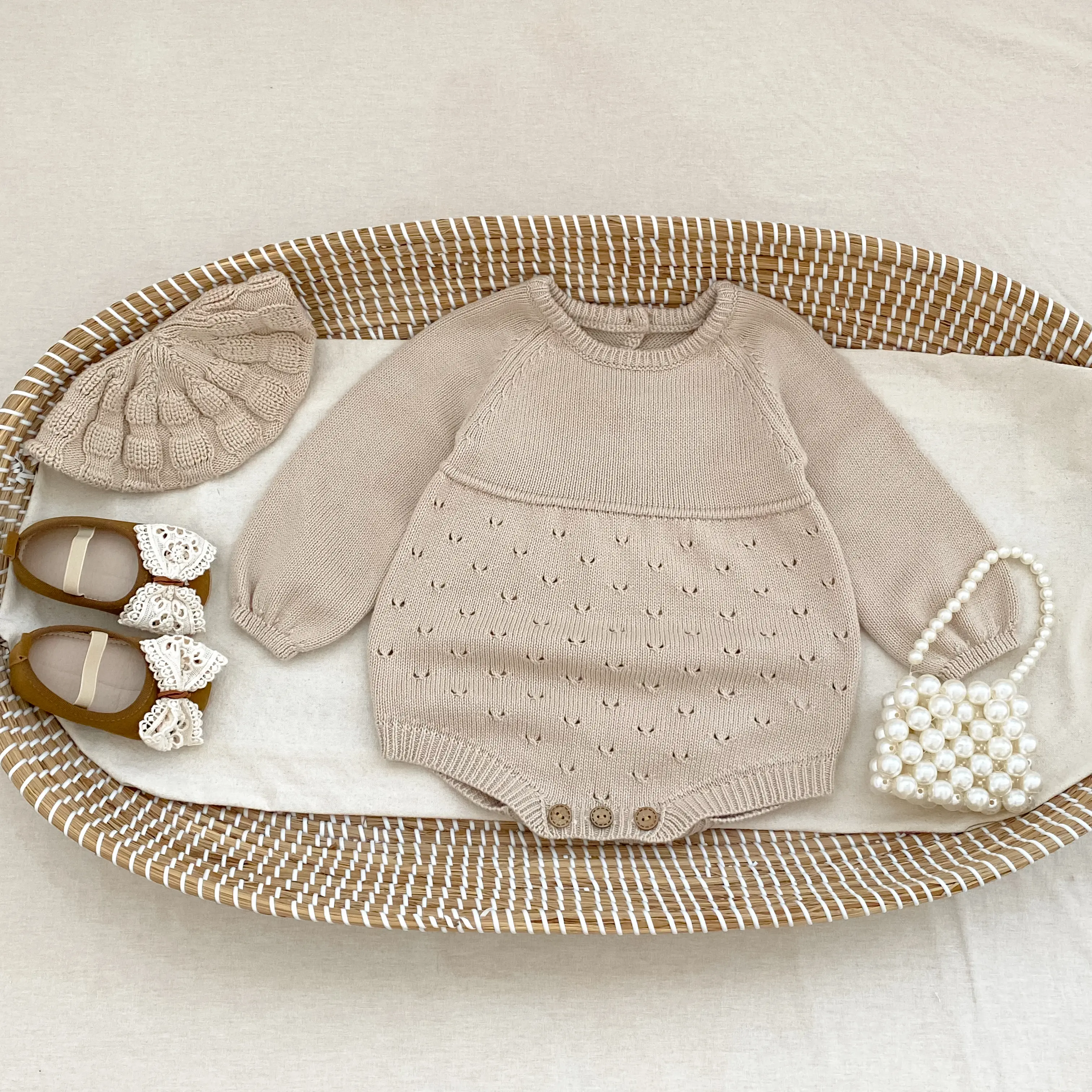 New autumn baby clothing: 0-3 year old girls' long sleeved hollow knitted jumpsuit, casual and versatile girls' jumpsuit