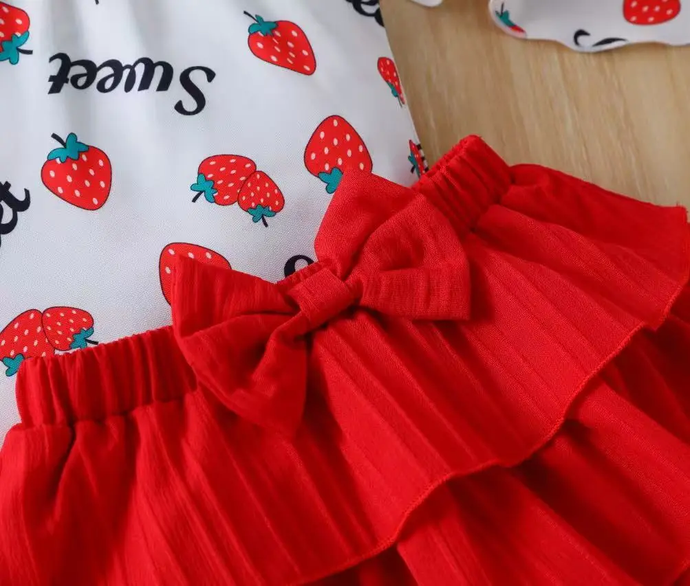 A Fashionable Summer Strawberry-Printed Off-Shoulder Crop Top, Mini Skirt, and Hat Set in a Sweet and Cute Style