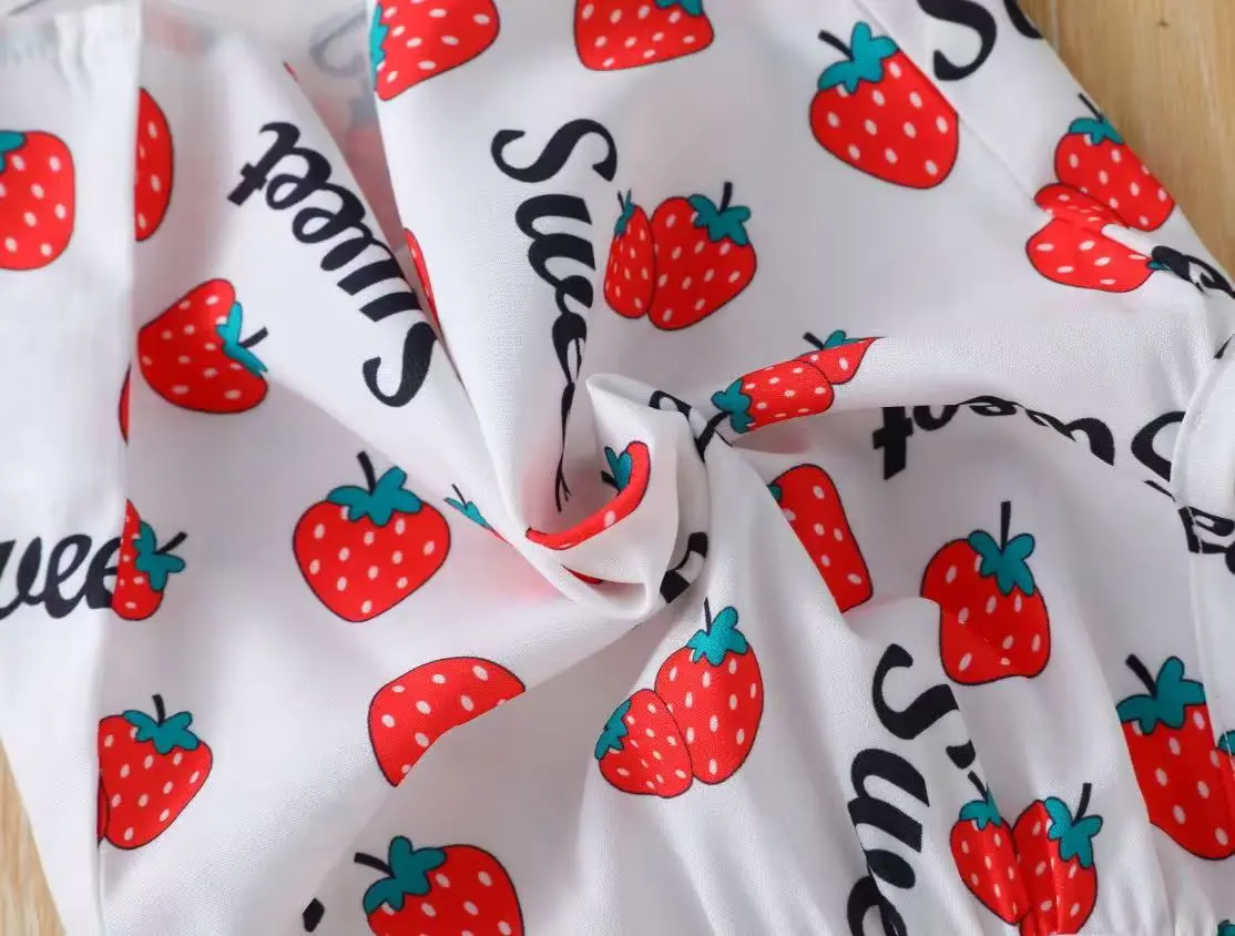 A Fashionable Summer Strawberry-Printed Off-Shoulder Crop Top, Mini Skirt, and Hat Set in a Sweet and Cute Style