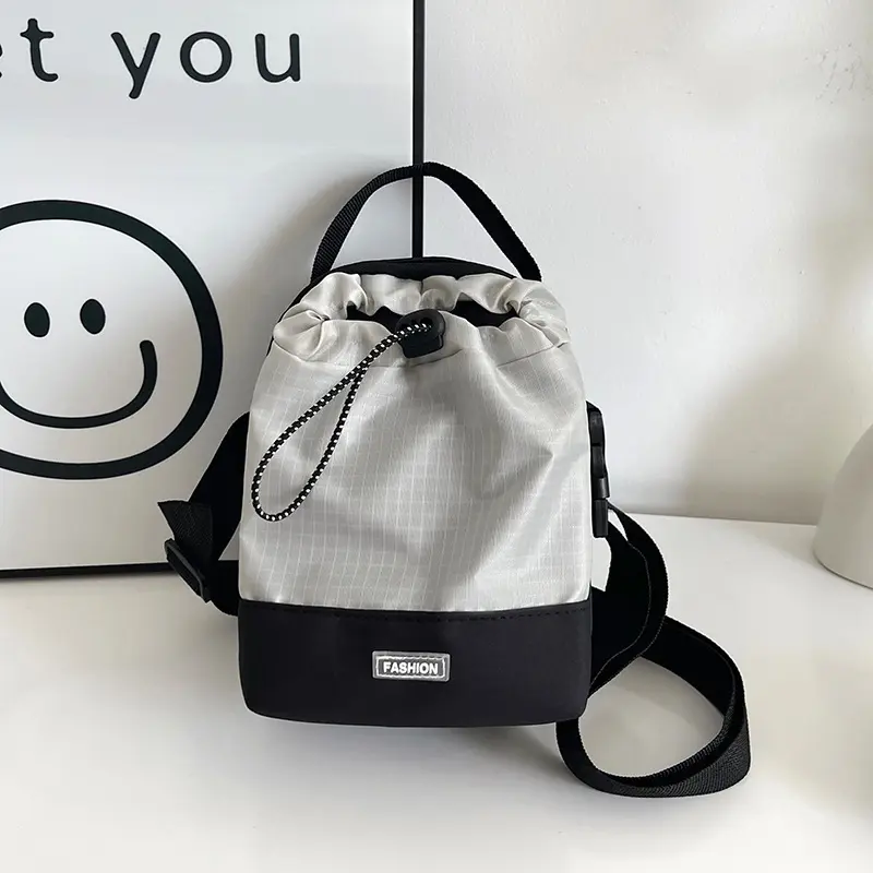 Neutral style small drawstring shoulder bag, fashionable, casual, waterproof, outdoor travel phone bag