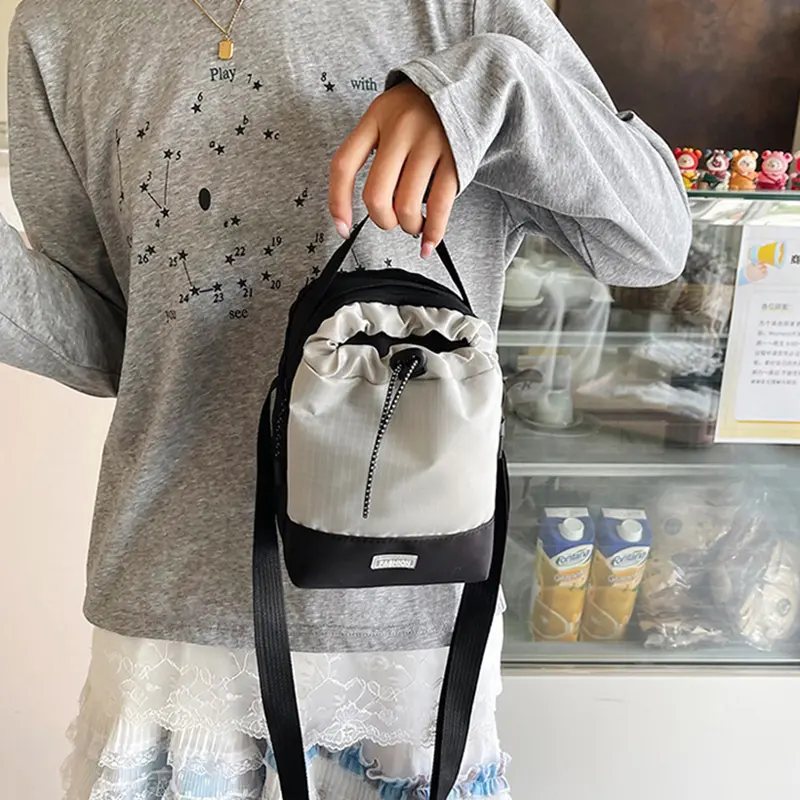 Neutral style small drawstring shoulder bag, fashionable, casual, waterproof, outdoor travel phone bag