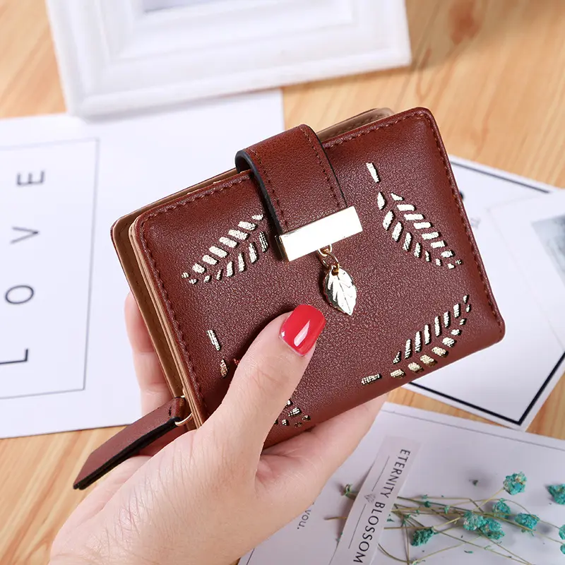 New Korean version of the short wallet lady zipper buckle hollow leaves small wallet wallet card package factory wholesale.