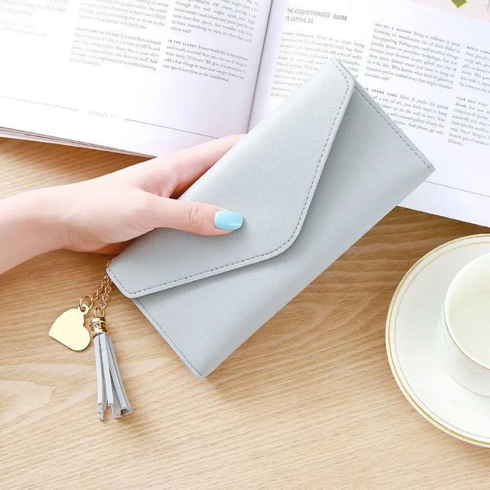New tassel pendant women's wallet, long fashionable coin purse, Korean version cute student zipper card bag and coin bag