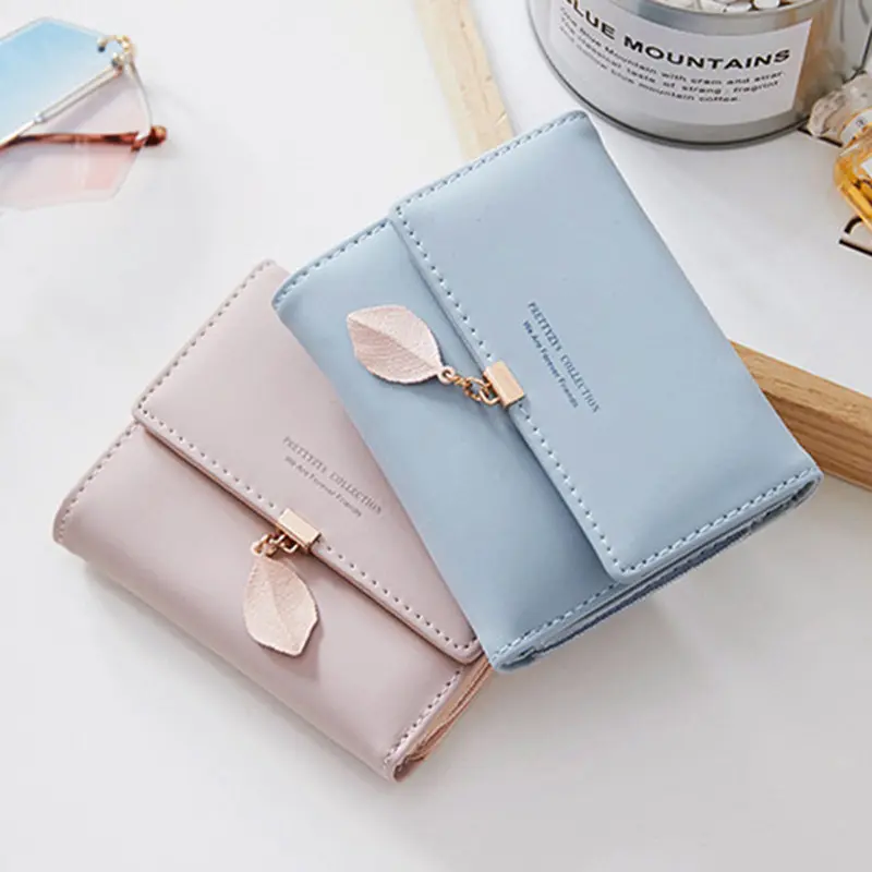 2024 Spring and summer new women's short wallet Japan and South Korea small fresh personality leaf pendant three fold bag simple