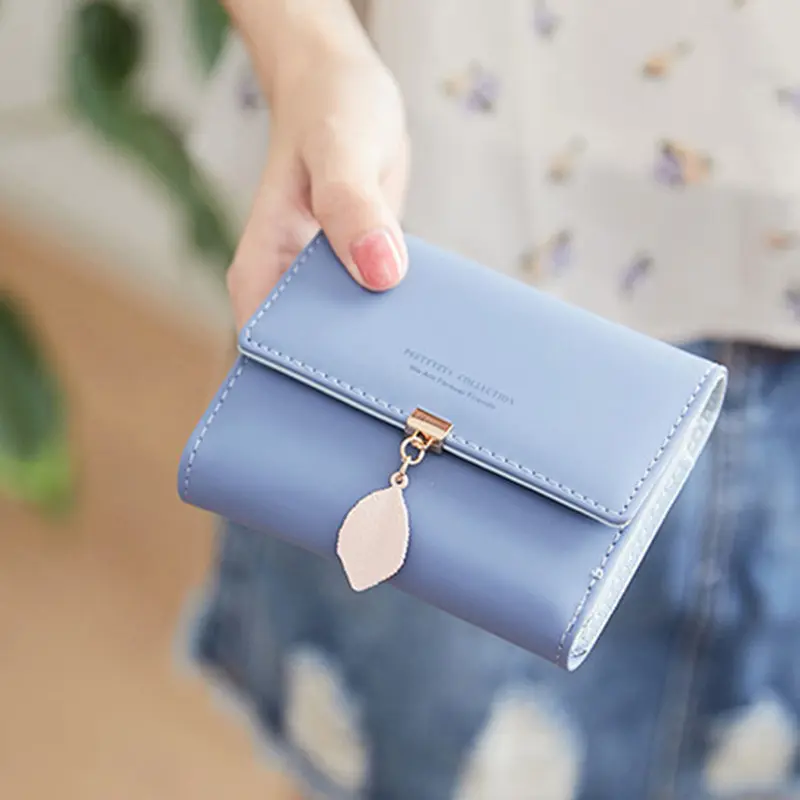 2024 Spring and summer new women's short wallet Japan and South Korea small fresh personality leaf pendant three fold bag simple
