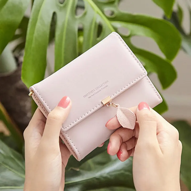 2024 Spring and summer new women's short wallet Japan and South Korea small fresh personality leaf pendant three fold bag simple