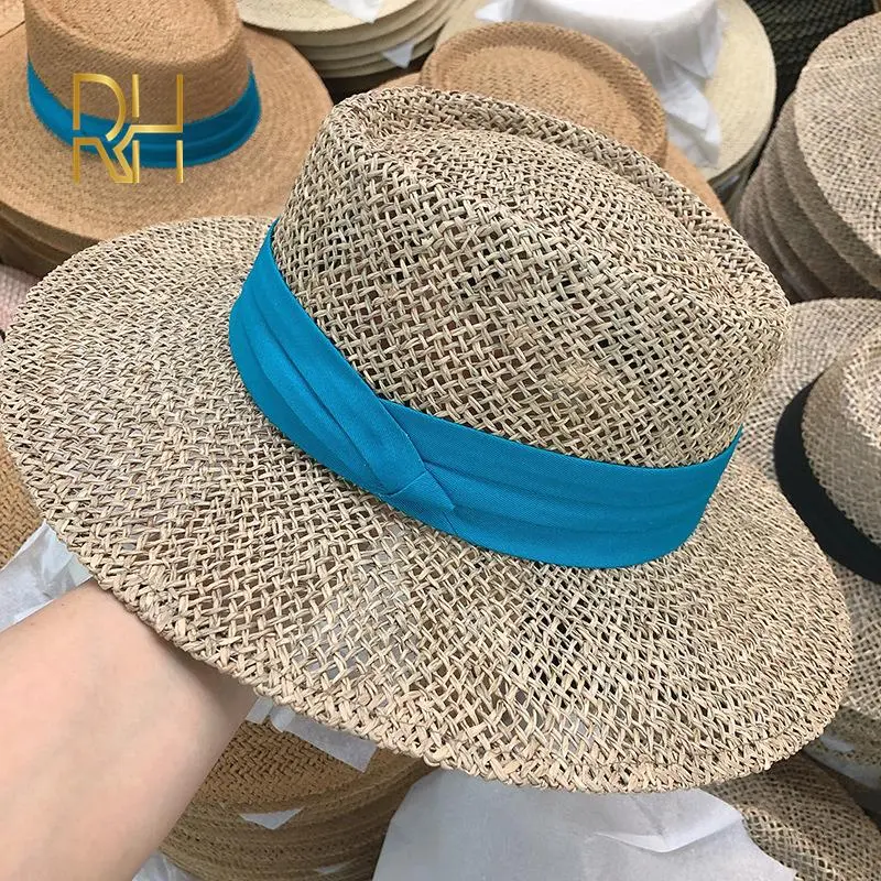 Travel Natural seagrass hollow flat brim hat ladies summer porkpie concave round sun hat beach straw hat with ribbon wholesale