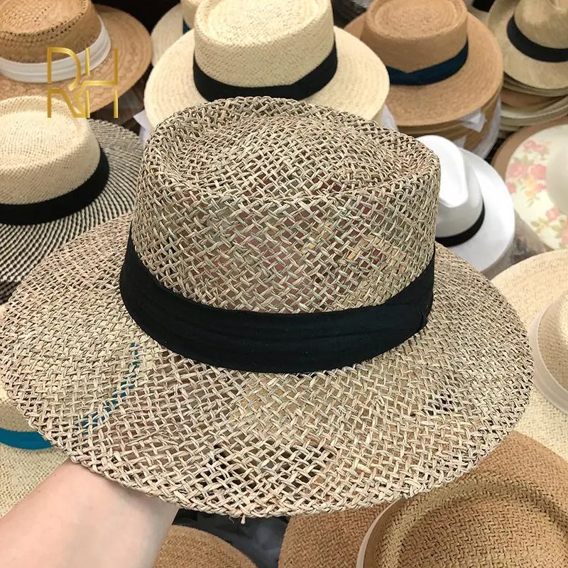Travel Natural seagrass hollow flat brim hat ladies summer porkpie concave round sun hat beach straw hat with ribbon wholesale