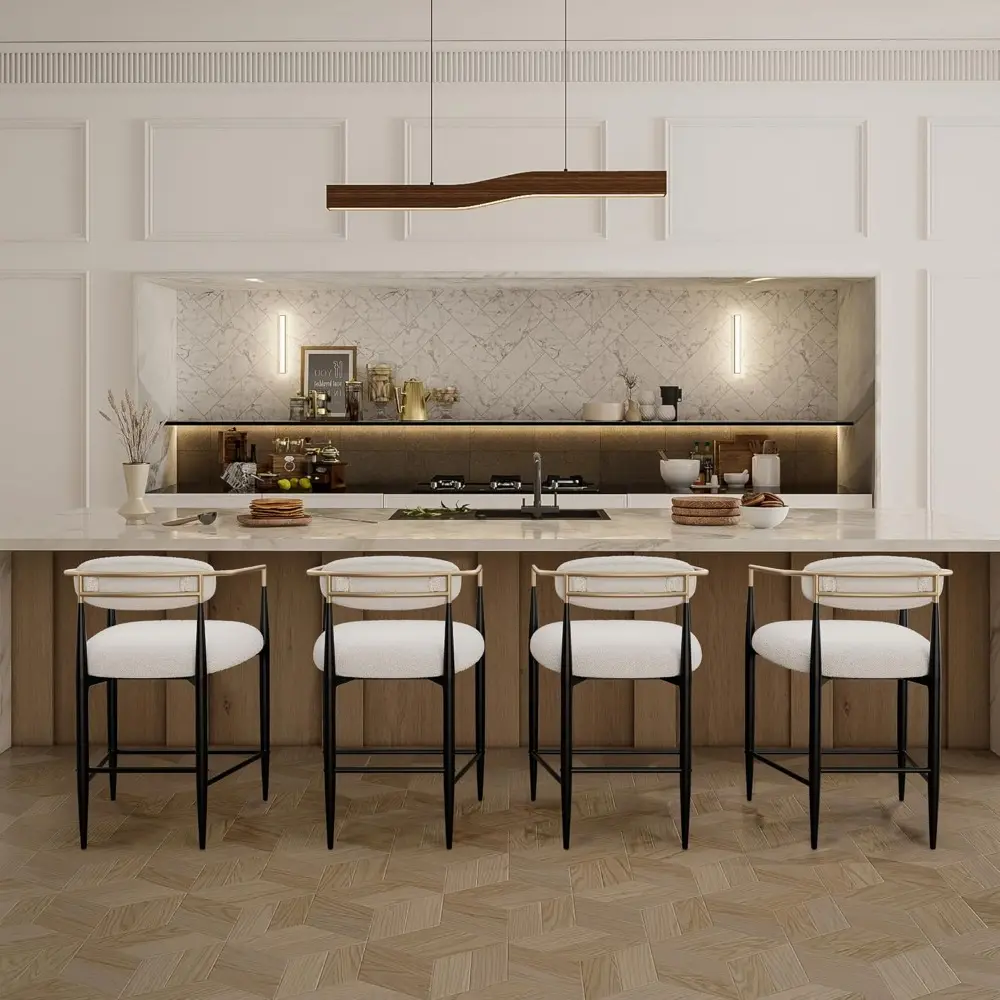 Pair of Modern Counter Height Stools: Upholstered with Gold Accents and Black Legs