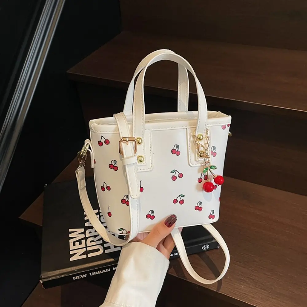 Women PU Cherry Shoulder Bag Large Capacity Trendy Commuting Bag with Cherry Pendant Stylish Crossbody Bag Aesthetic Handbag