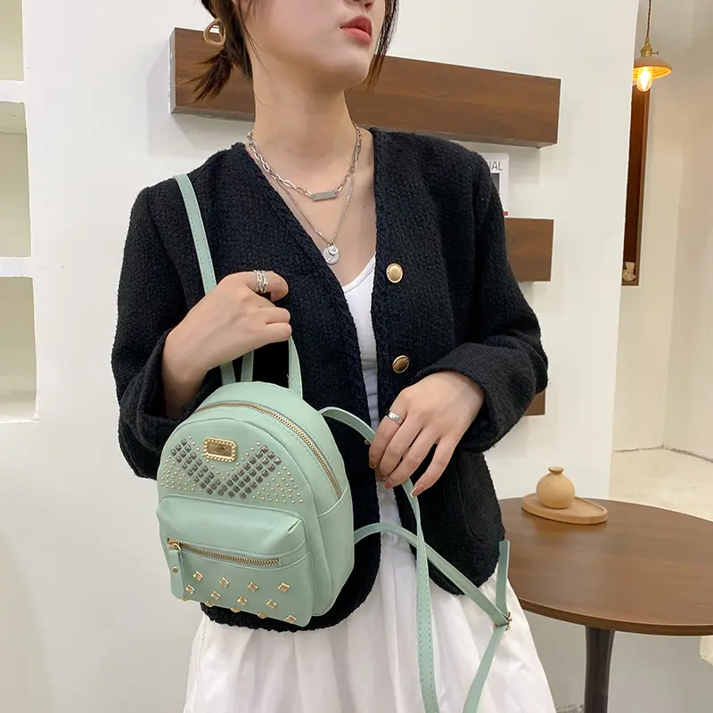 Riveted small schoolbag new women's school bag wholesale leisure backpack backpack