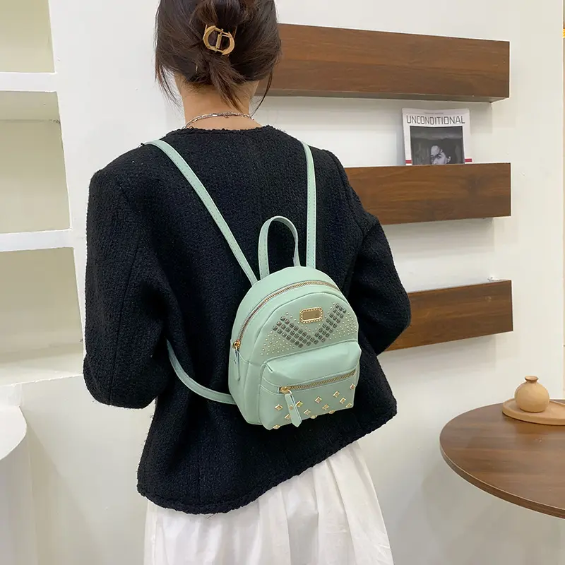 Riveted small schoolbag new women's school bag wholesale leisure backpack backpack