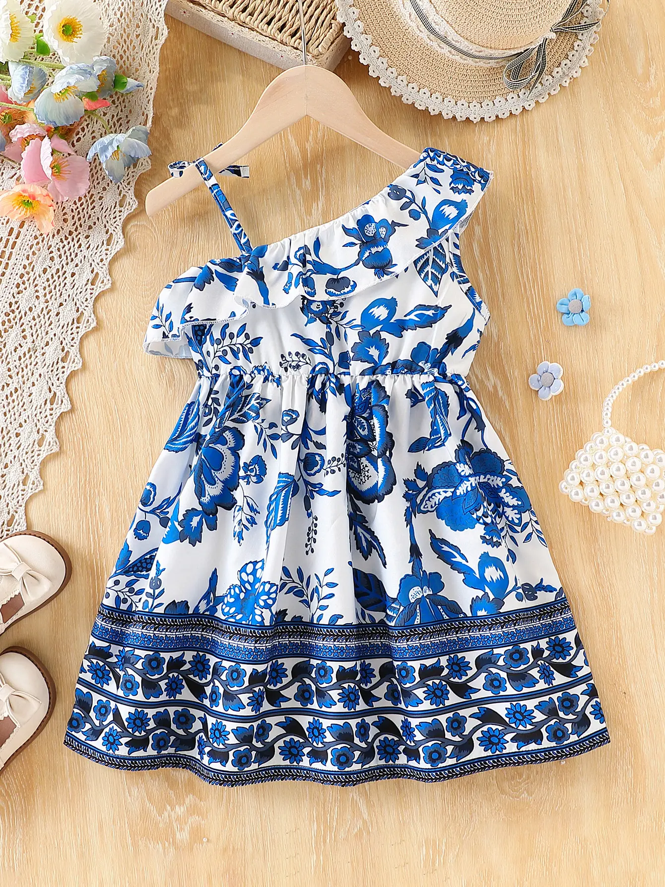 Single piece girls' fashionable leisure vacation ruffle edge decoration bow decoration sloping shoulder suspender dress summer