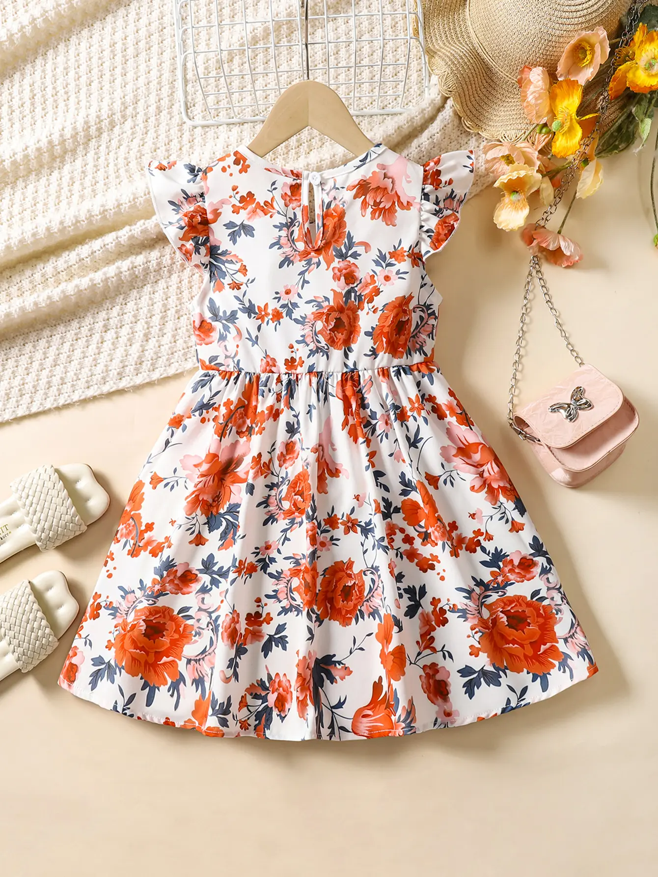 A soft and comfortable summer dress with printed lotus leaf sleeves and a fashionable round neck for girls