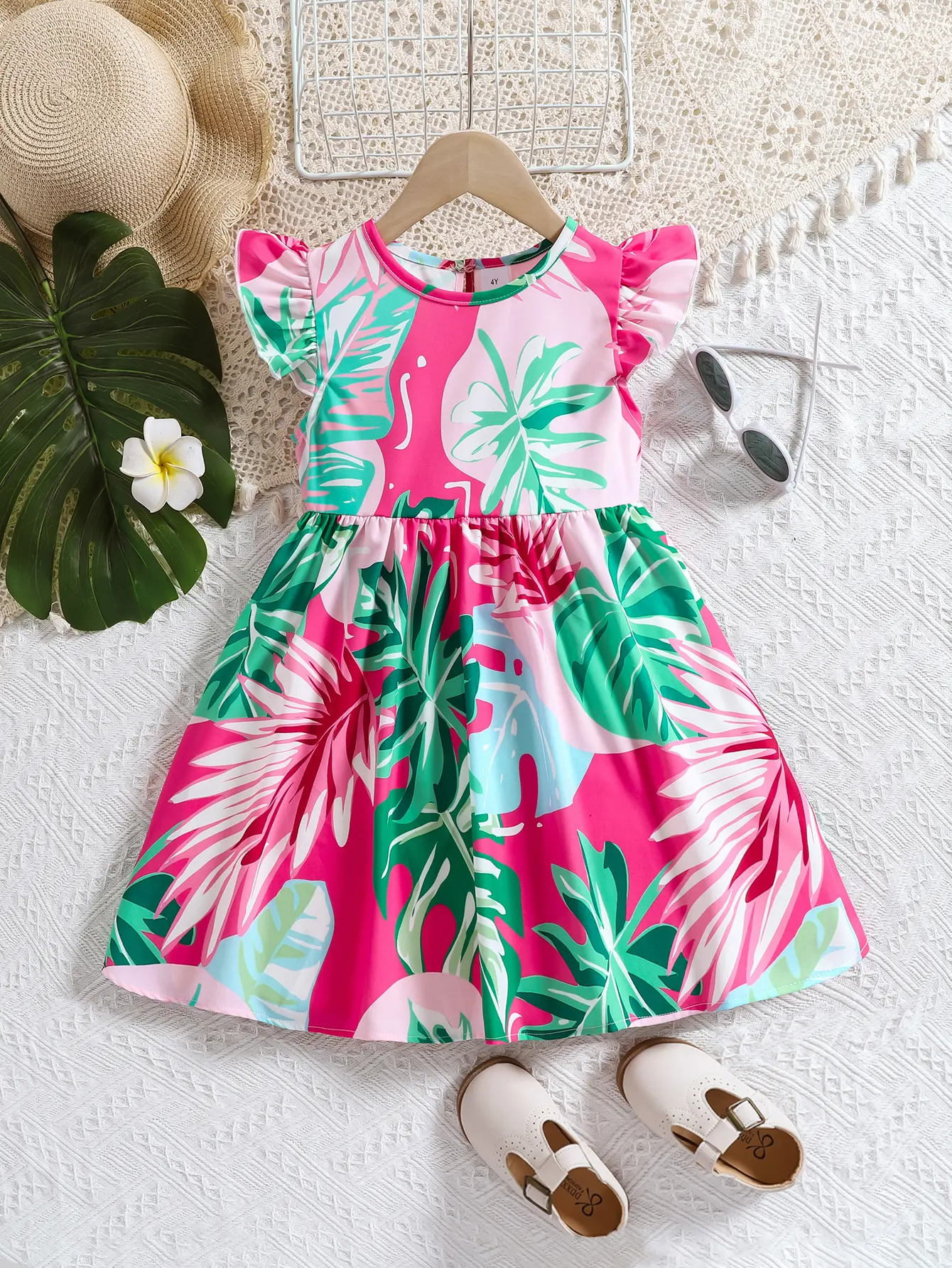 A soft and comfortable summer dress with printed lotus leaf sleeves and a fashionable round neck for girls