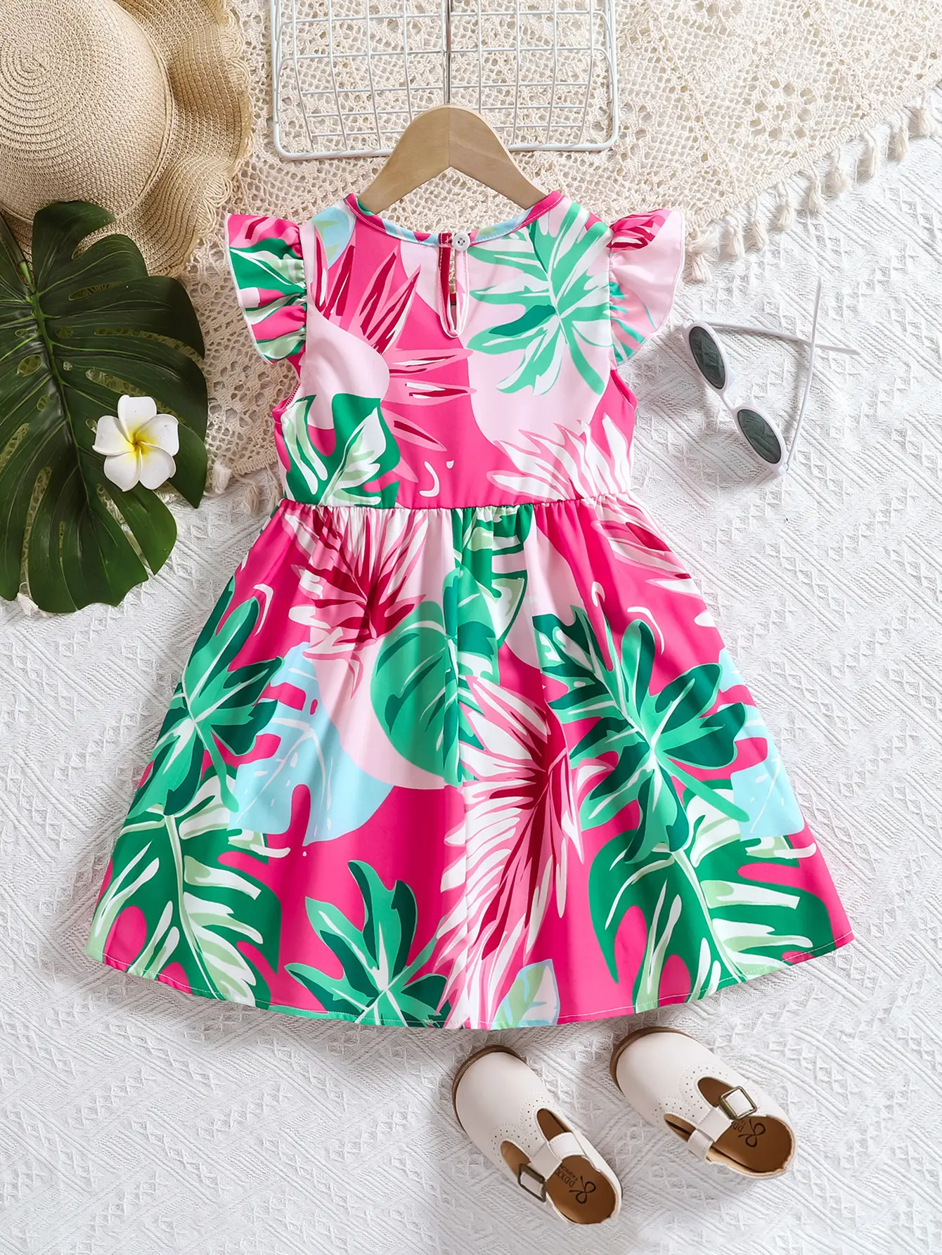 A soft and comfortable summer dress with printed lotus leaf sleeves and a fashionable round neck for girls