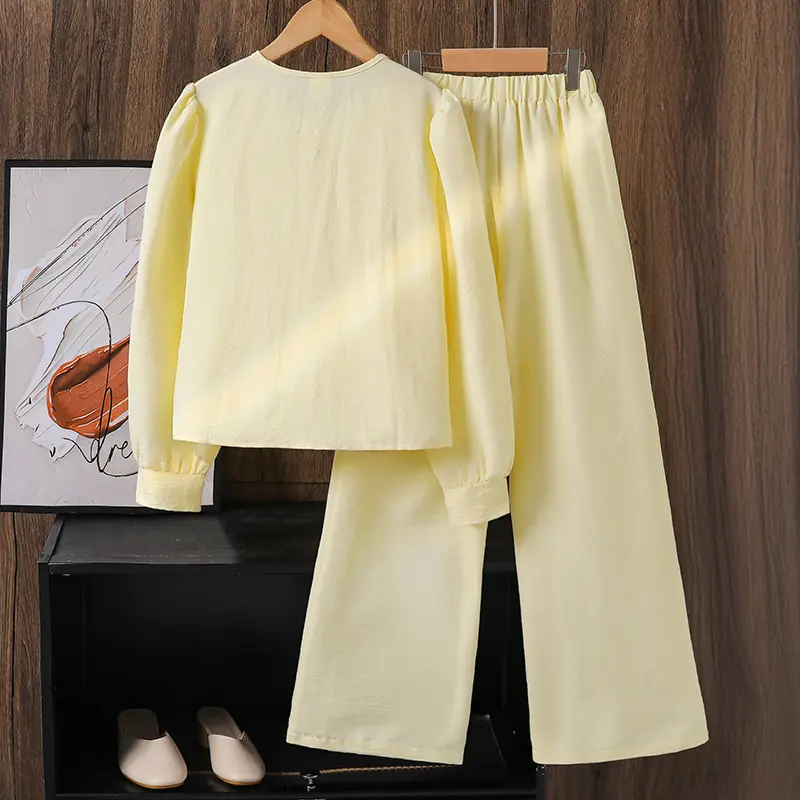 Big child's sweet two-piecesSpring/summer yellow bow detailPuffed sleevesRounded necklineFrilled hemLong-sleeved topYellow strai