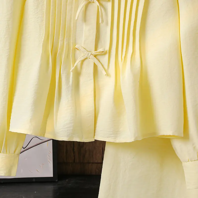 Big child's sweet two-piecesSpring/summer yellow bow detailPuffed sleevesRounded necklineFrilled hemLong-sleeved topYellow strai