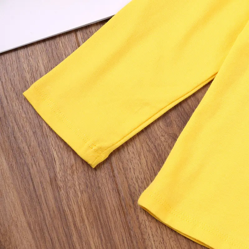 Unisex Playful Cartoon Little Dino Yellow Long Sleeve T-Shirt Spring-Fall Casual Cute Base Layer Top for Everyday Wear
