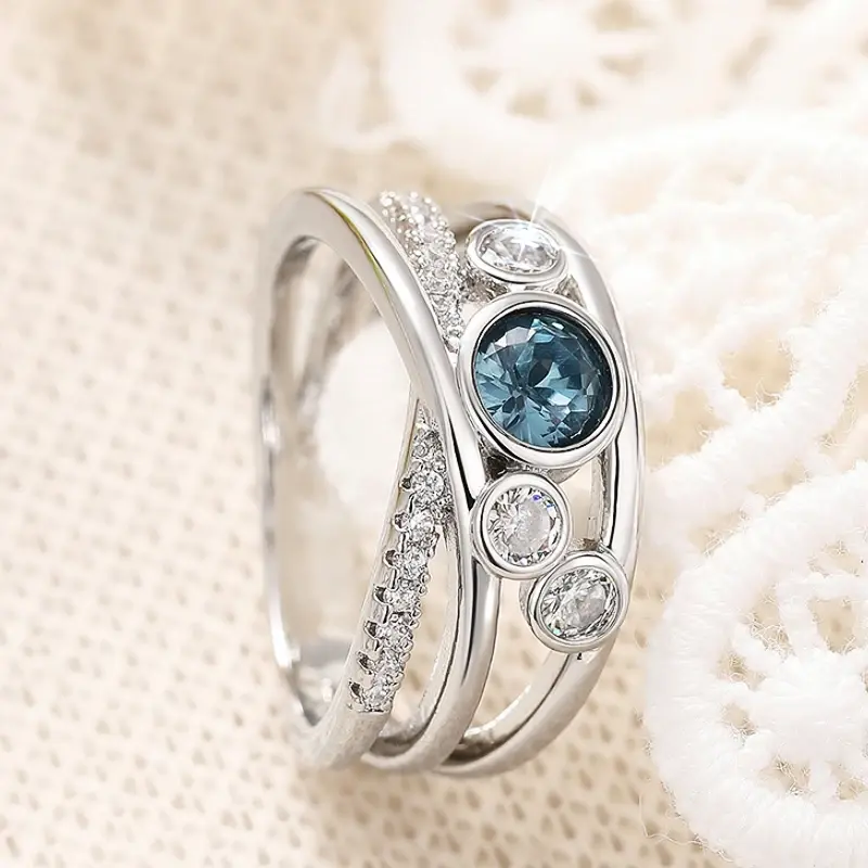 Huitan Trendy Cross Silver Color Finger Ring Female Shiny Blue Zirconia Accessories for Engagement Party Fashion Jewelry Gift