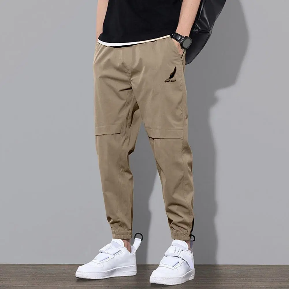 Trendy Logo Print Men Pants Mid-Rise Elastic Waistband Pockets Men Pants Solid Color Loose Fit Sweatpants Casual Streetwear