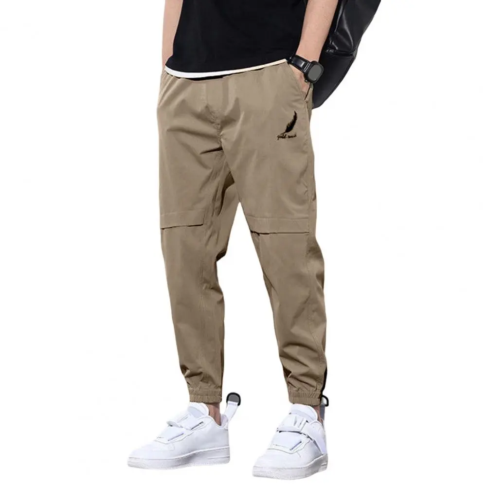 Trendy Logo Print Men Pants Mid-Rise Elastic Waistband Pockets Men Pants Solid Color Loose Fit Sweatpants Casual Streetwear