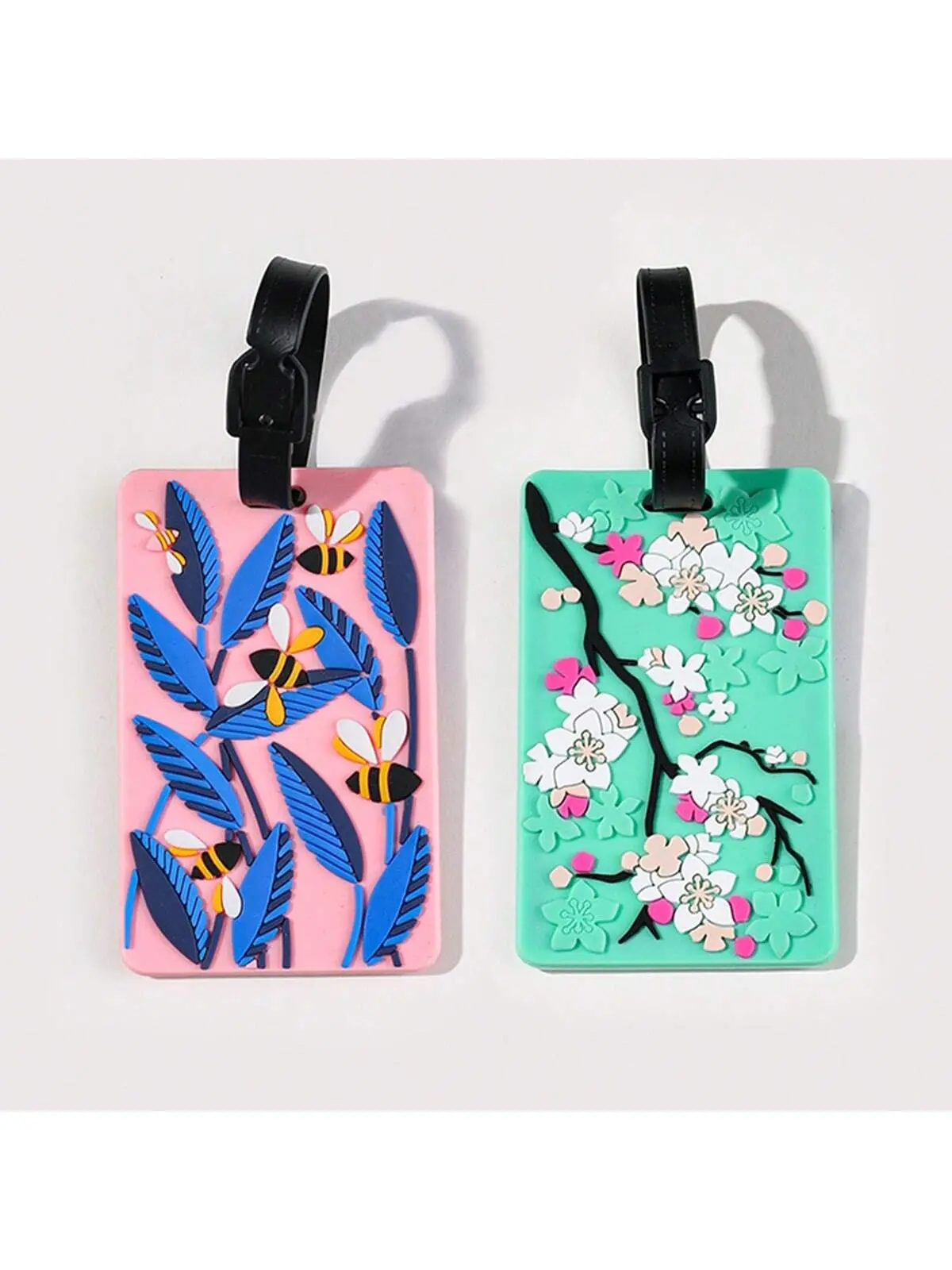 Luggage tags with floral patterns, aircraft boarding passes with colored luggage identifiers, and travel identification tagsA-DH